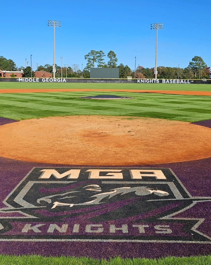 The MGA Knights Athletics logo spray painted on the baseball field home base